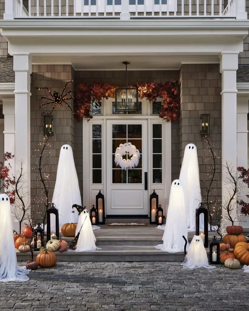 Coastal style entrance with white ghost decorations autumn garland lanterns
