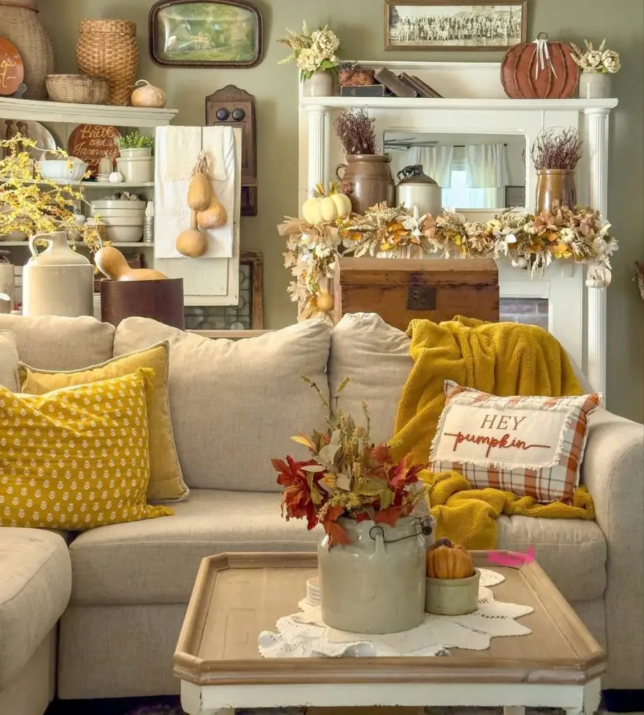 Living room with mustard accents and autumn fireplace decor