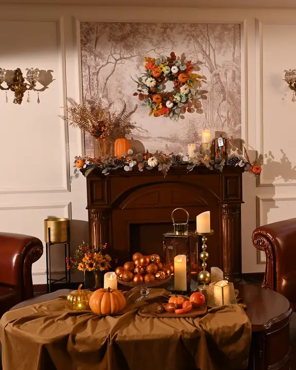 Traditional fireplace with copper autumn decorations and candles