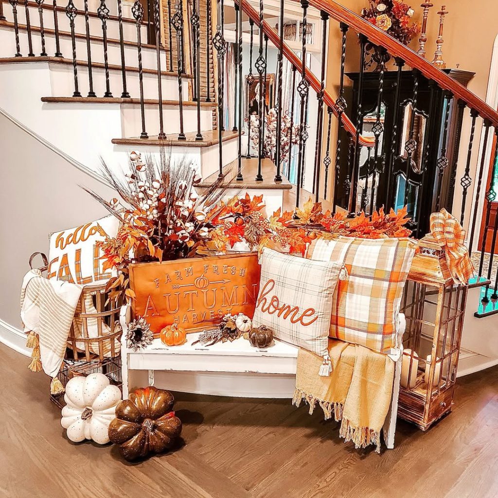 Foyer bench with autumn pillows and seasonal decorations