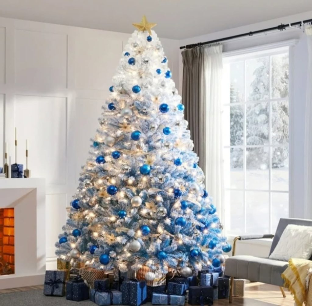 White Christmas tree with blue baubles in living room