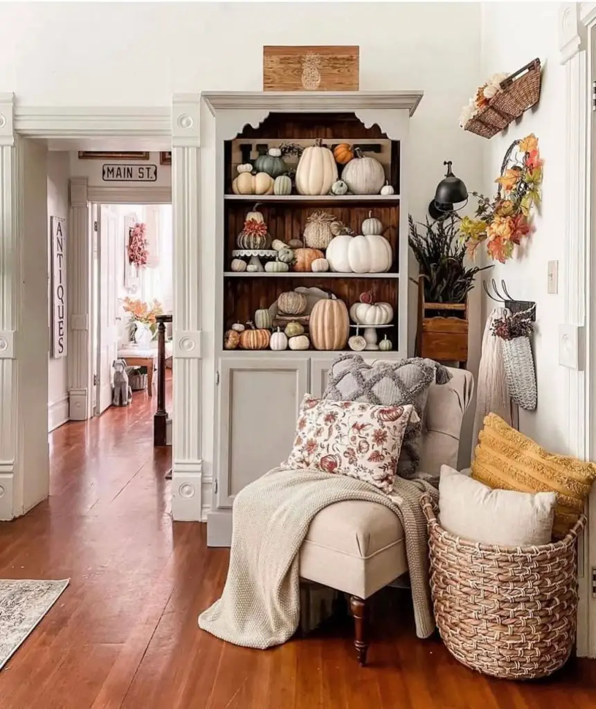 Built-in shelves displaying various pumpkins autumn decorations farmhouse style corner