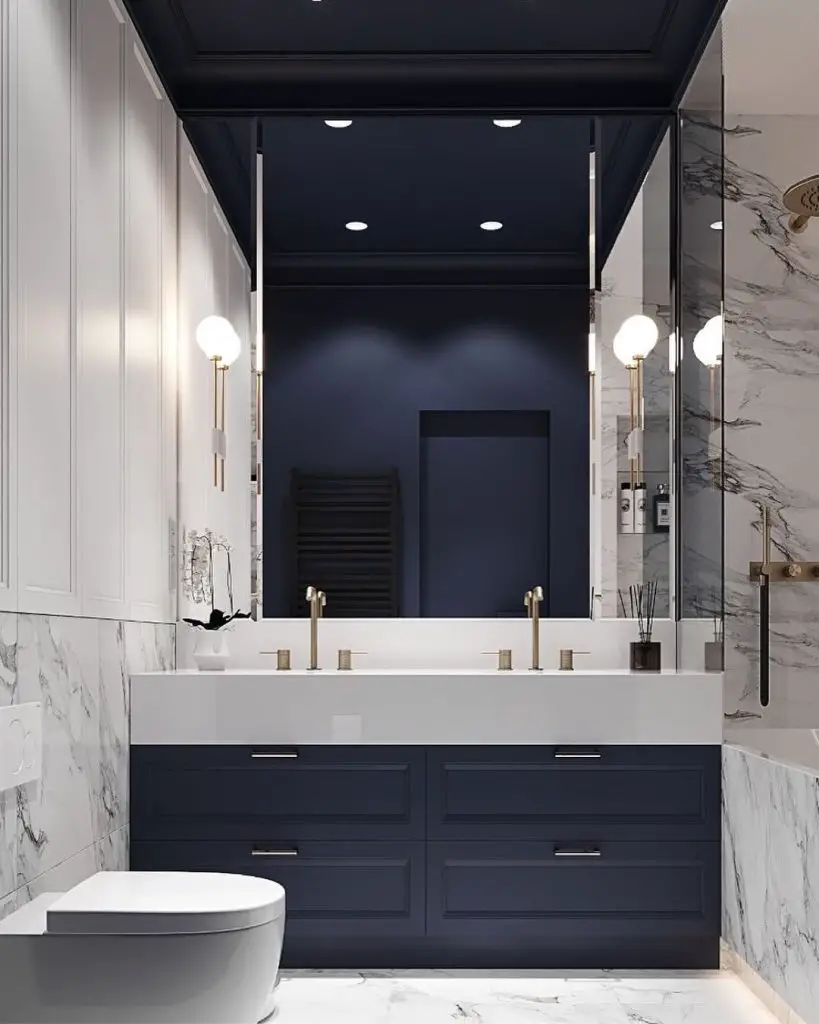 Navy and marble bathroom with floating vanity