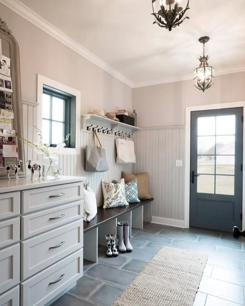 Farmhouse mudroom with beadboard walls and slate tile flooring