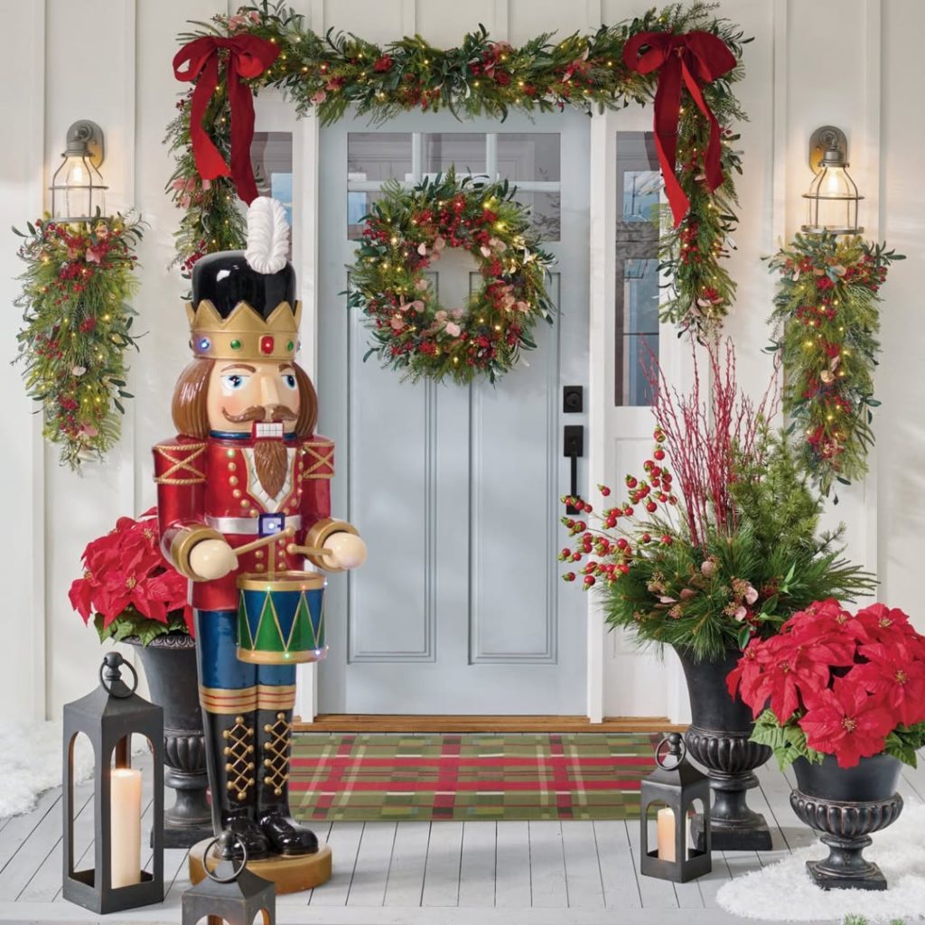 Front door decorated with nutcracker soldier and Christmas garland display