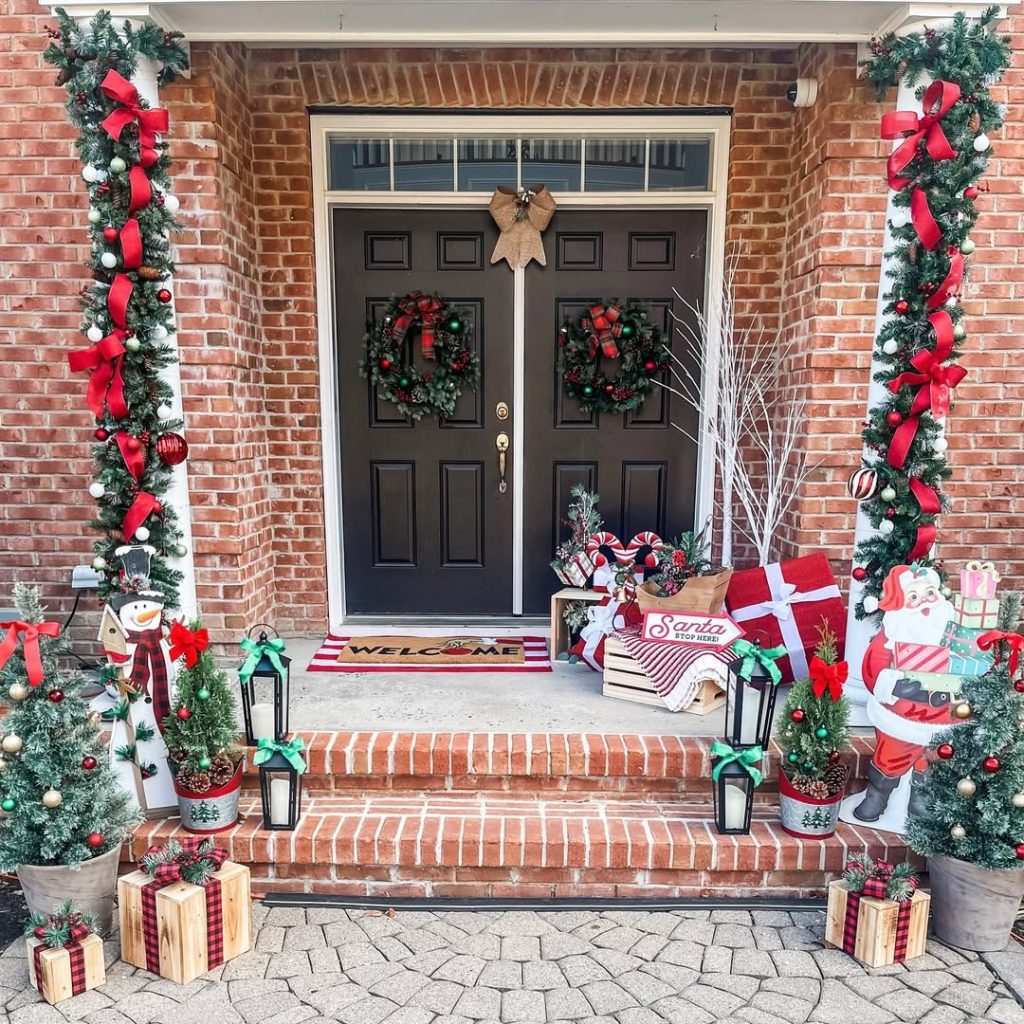 Brick entrance with garland trees gift boxes plaid runner