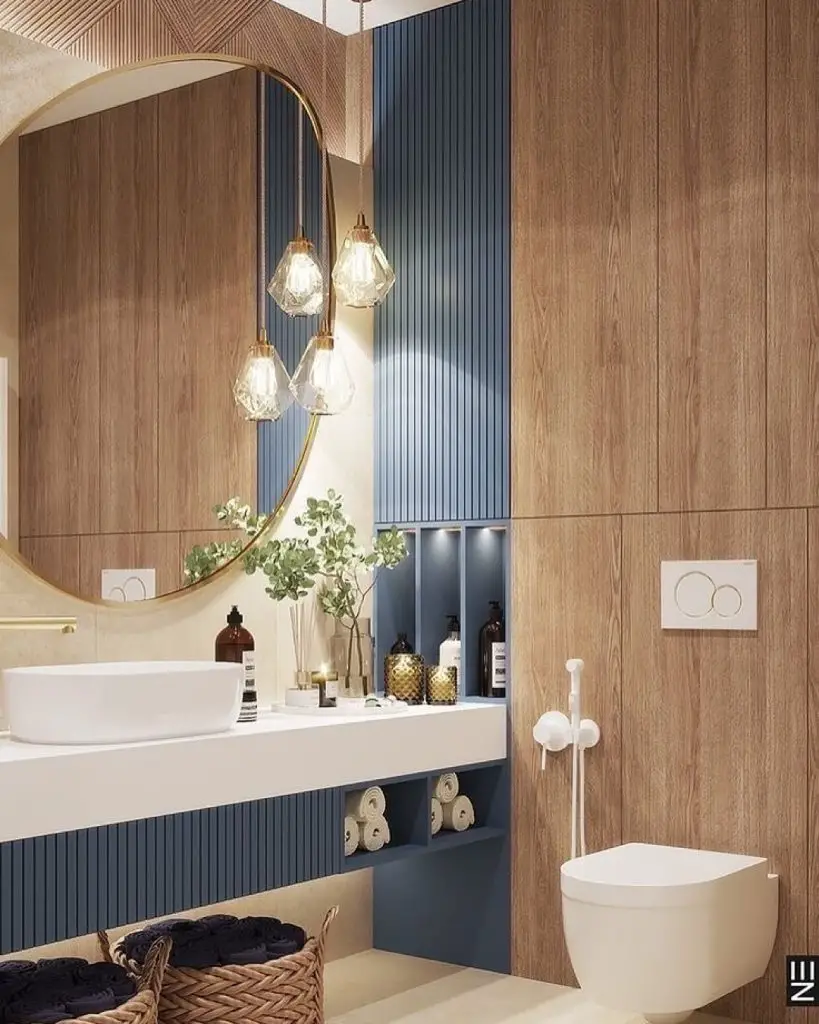 Wood and blue bathroom with round mirror