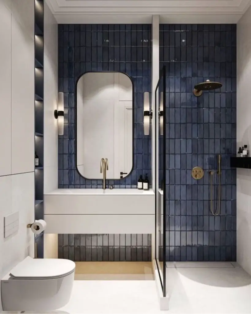 Navy geometric tile bathroom with curved vanity