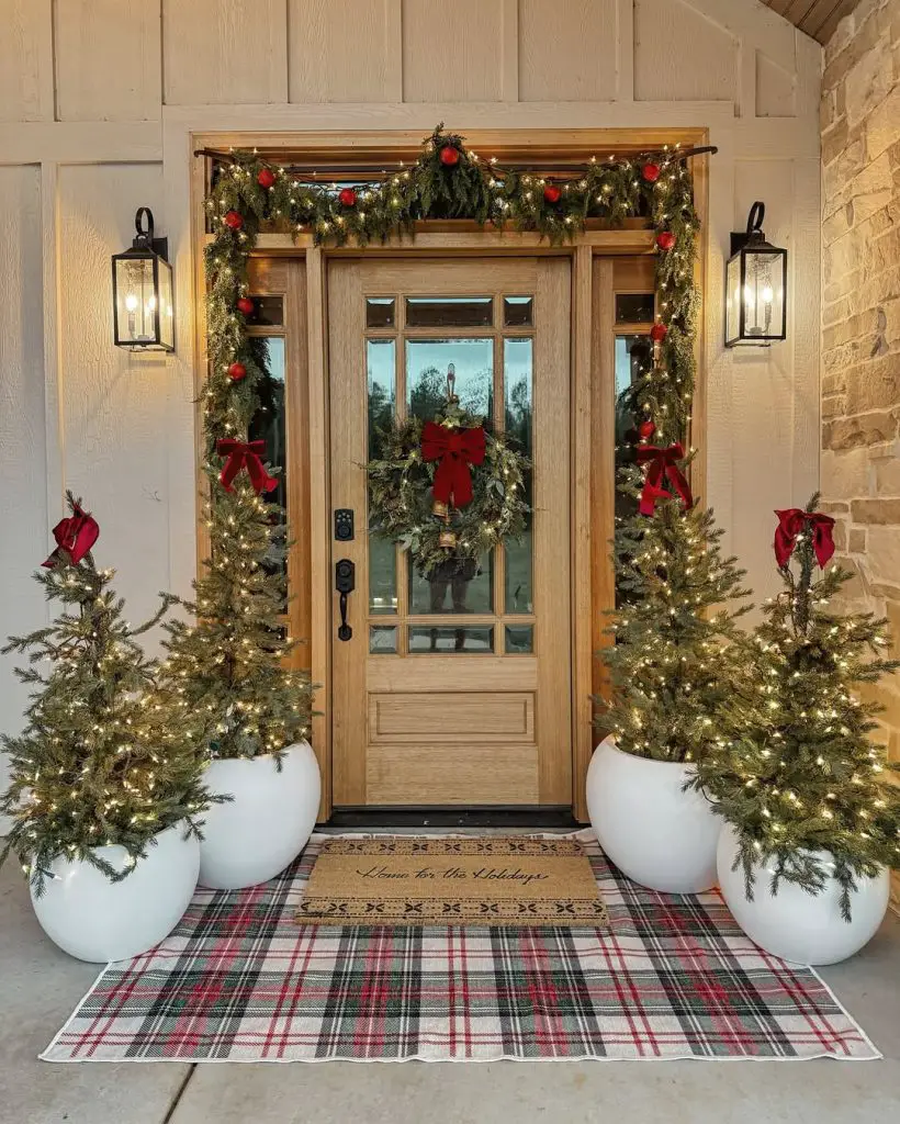 Snow covered wooden pergola with hanging evergreen decorations