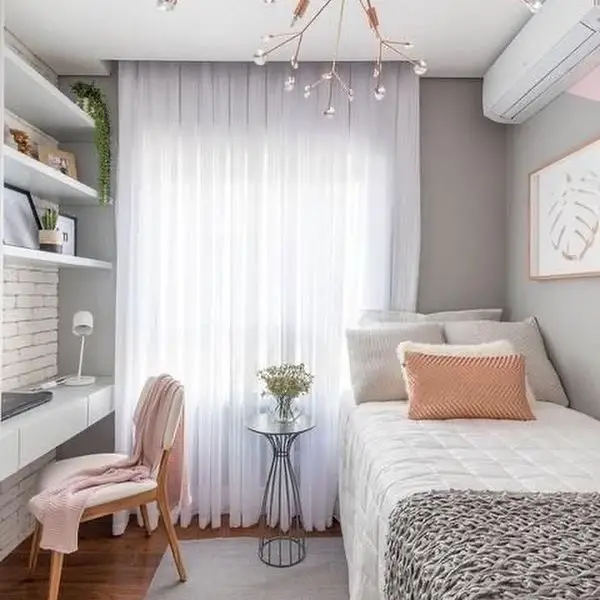 Minimalist bedroom with soft lighting and neutral tones