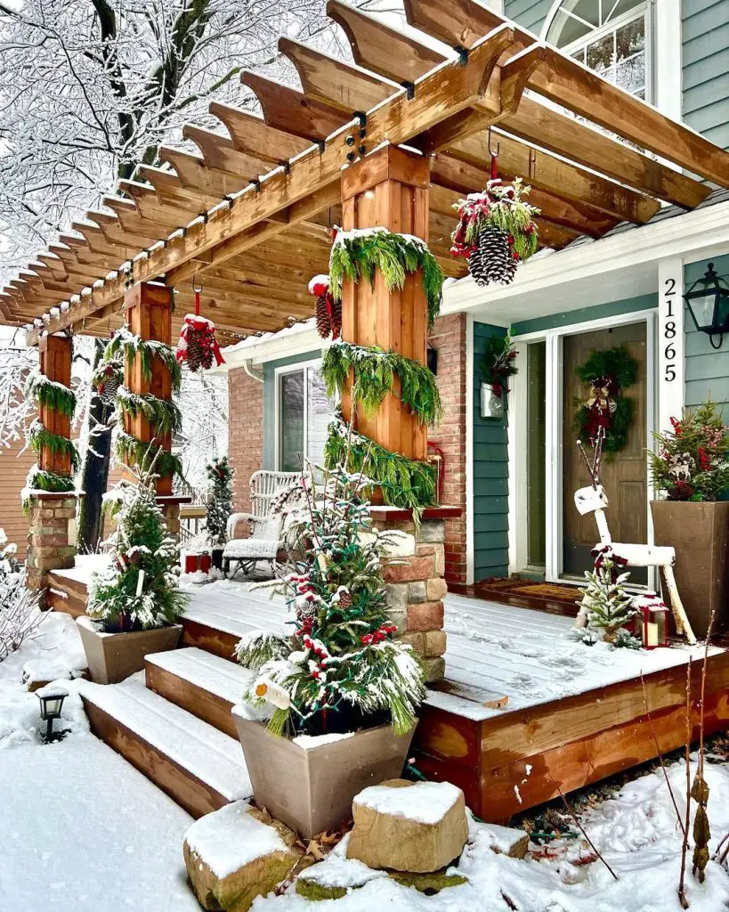Cottage porch with Santa ornament garland roofline lights