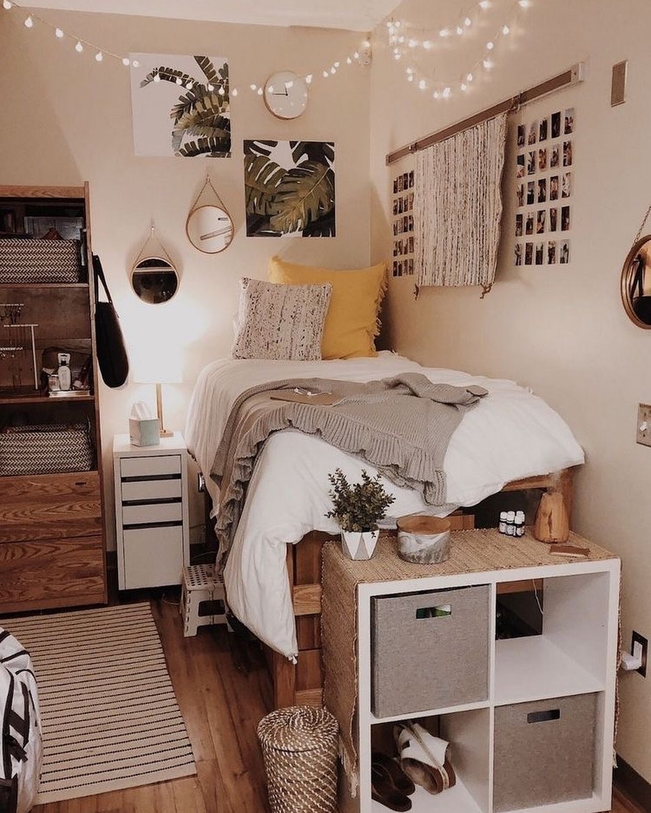 Elevated dorm bed with string lights and storage