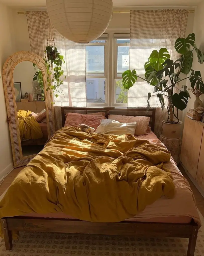 Bedroom with yellow bedding and natural textures
