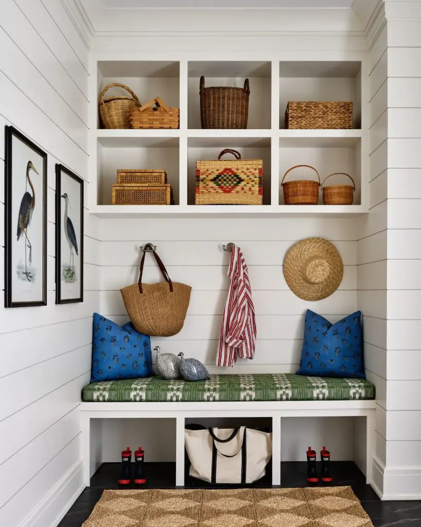 White shiplap mudroom with woven basket collection display