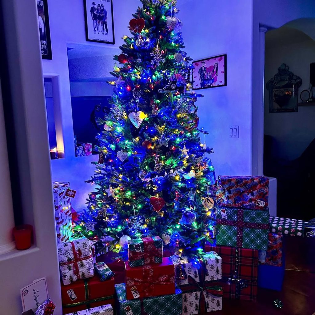 Christmas tree with colorful lights in modern living room