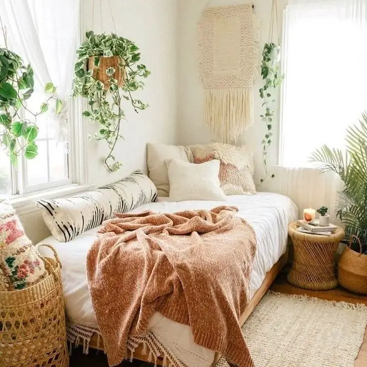 Bohemian bedroom filled with hanging plants and baskets