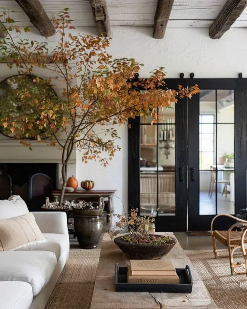 Living room with autumn tree centerpiece and natural decorations