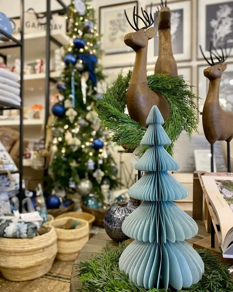 Wooden reindeer decorations with paper Christmas tree display