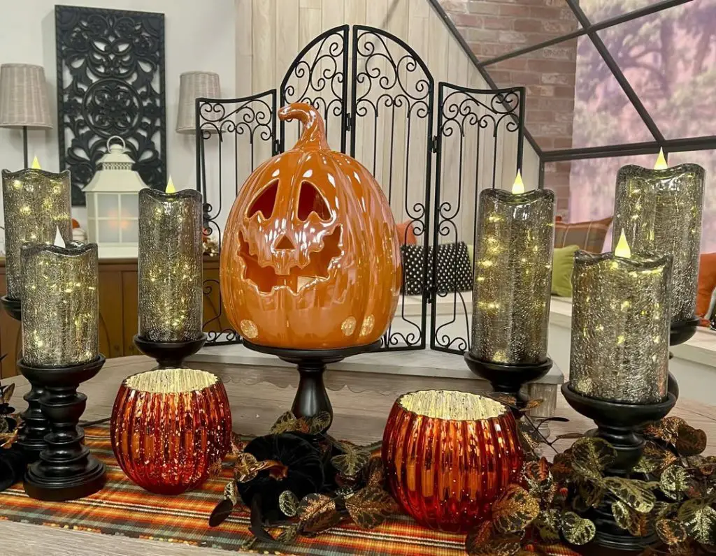 Halloween tablescape with candles pumpkin fireplace screen elegant styling