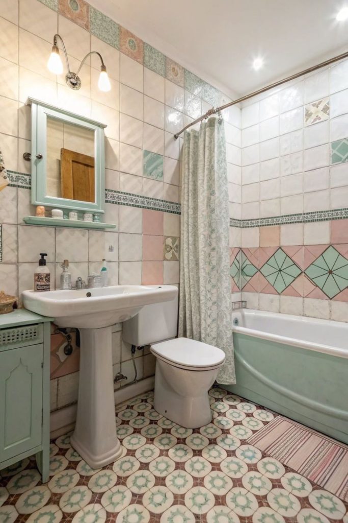 Artistic patchwork tile bathroom with color.