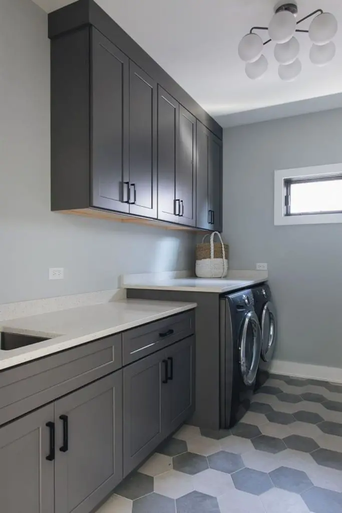 Geometric hexagon tiles with charcoal cabinetry