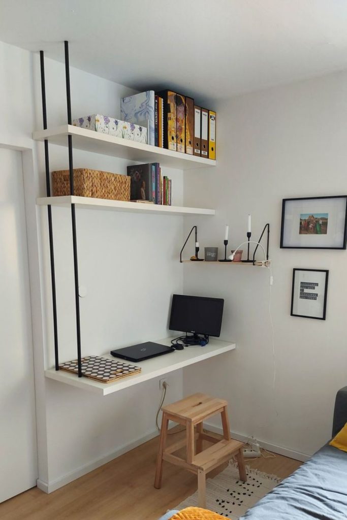 Ceiling hung floating desk with cables