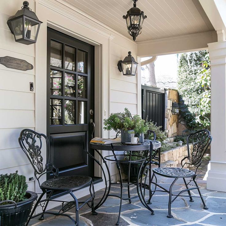 Symmetrical porch with slate and ivy.