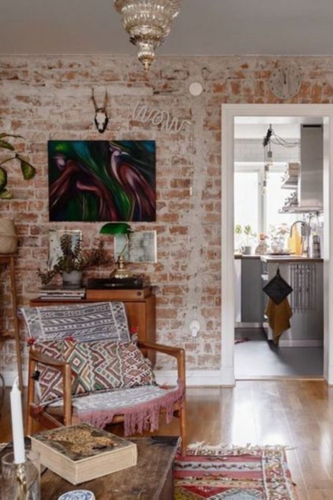 Brick walls with scattered canvases.
