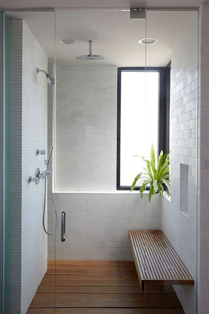 Fold-down bench offers compact shower seating.