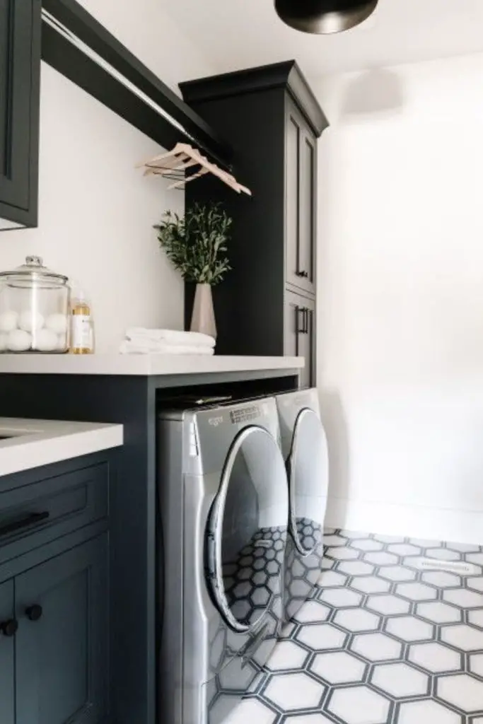 Distressed black cabinets cottage farmhouse laundry