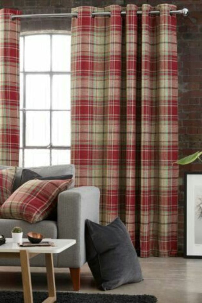 Plaid curtains enhance autumn window views.