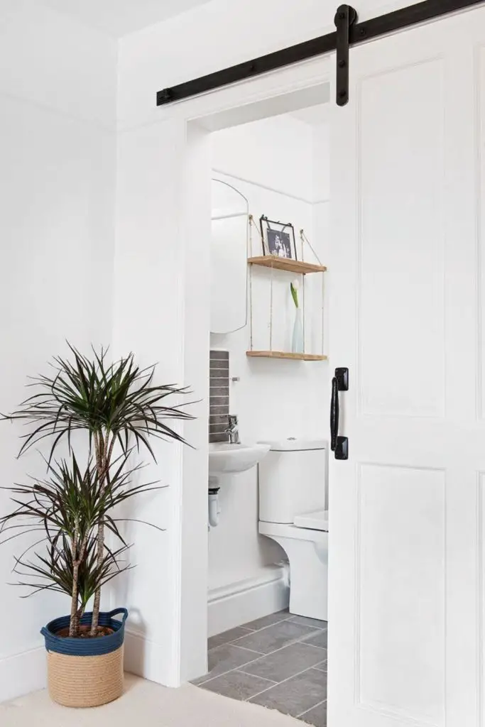 Sliding pocket door saves toilet space