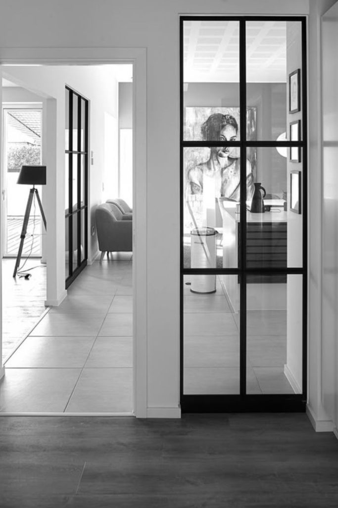 Glass partitions with steel surfaces.