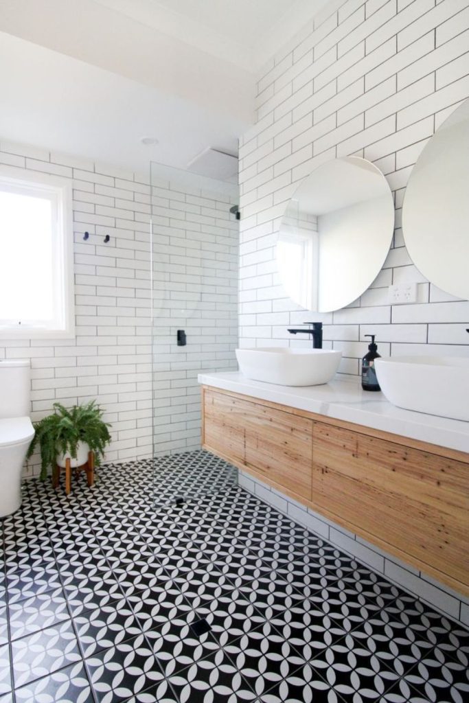 Subway tile wetroom with black grout
