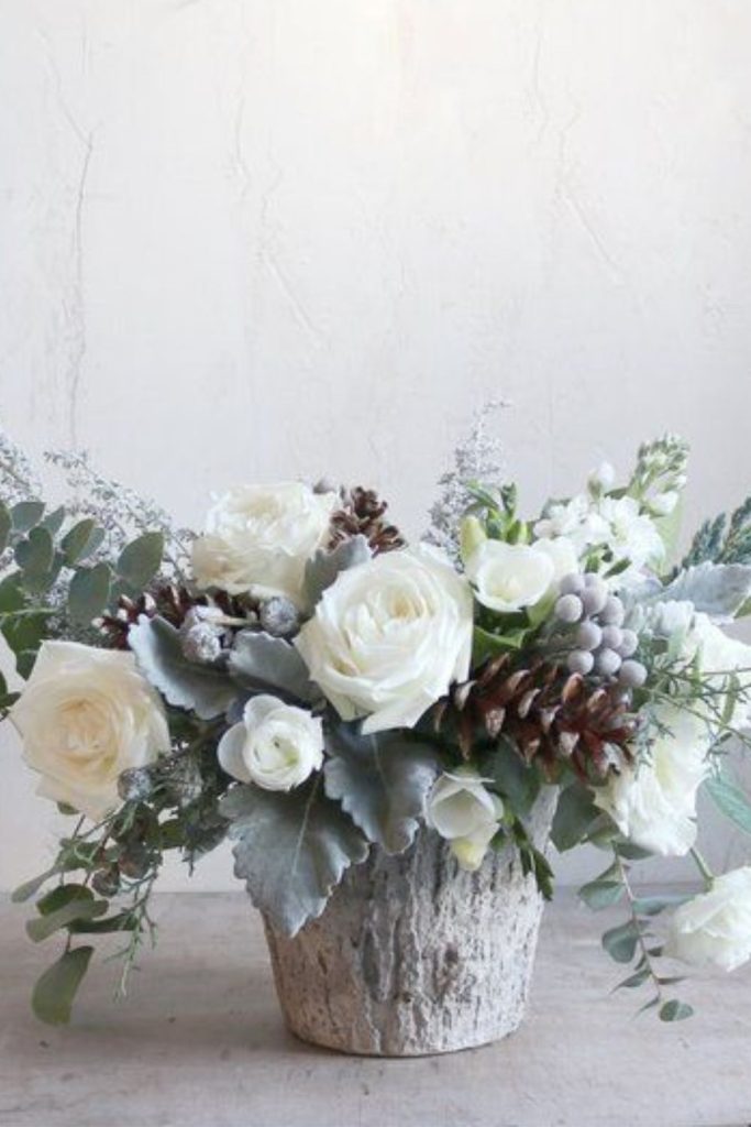 Aspen branch and ivory ranunculus crest