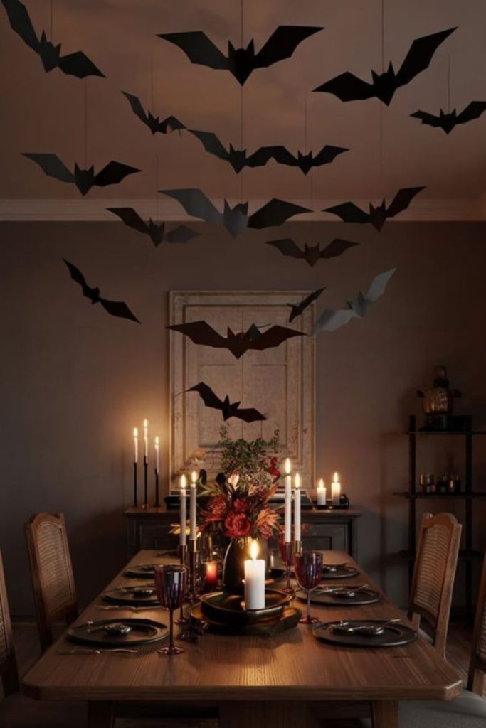 Bat silhouettes flying above spooky table.