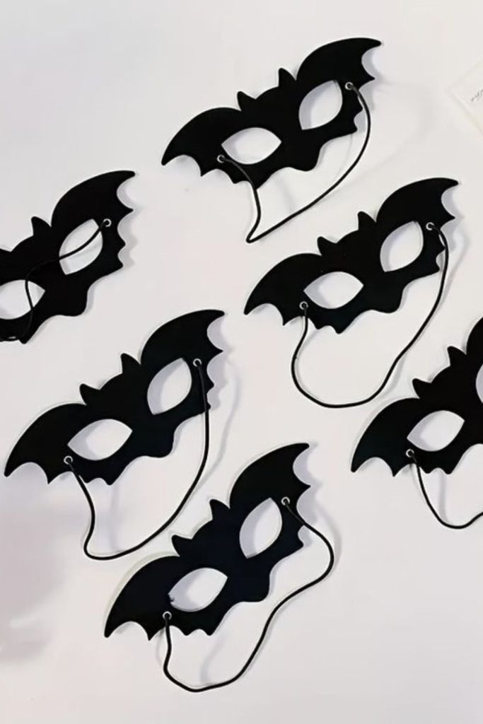 Kids wearing handmade bat paper masks.