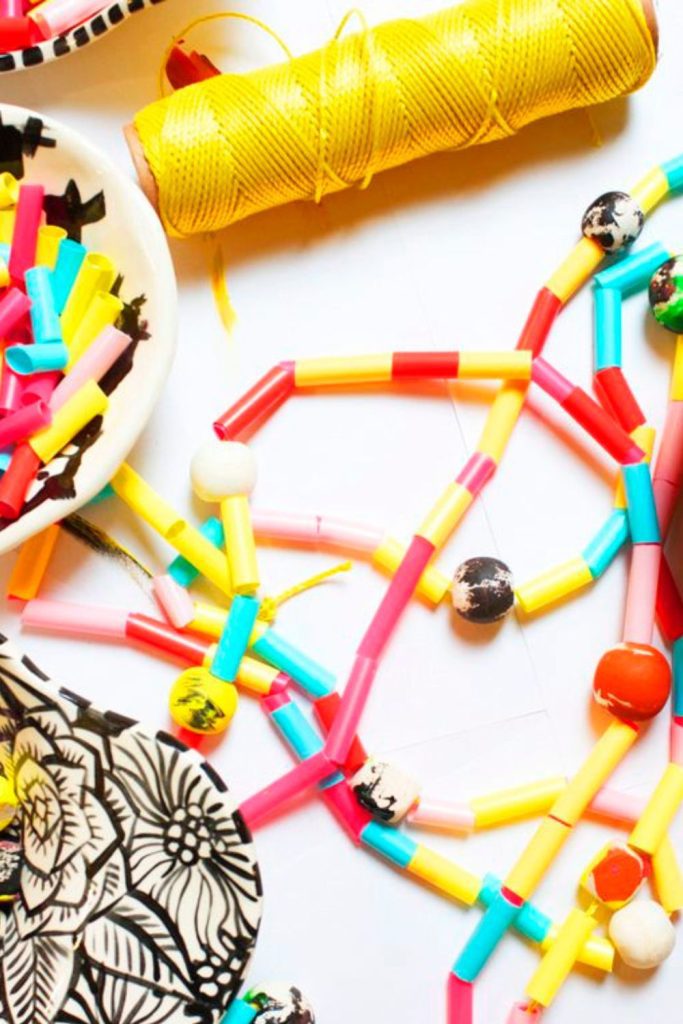 Bone rattle necklaces made by kids.
