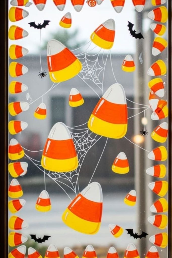 Candy corn shapes decorating glass panes.