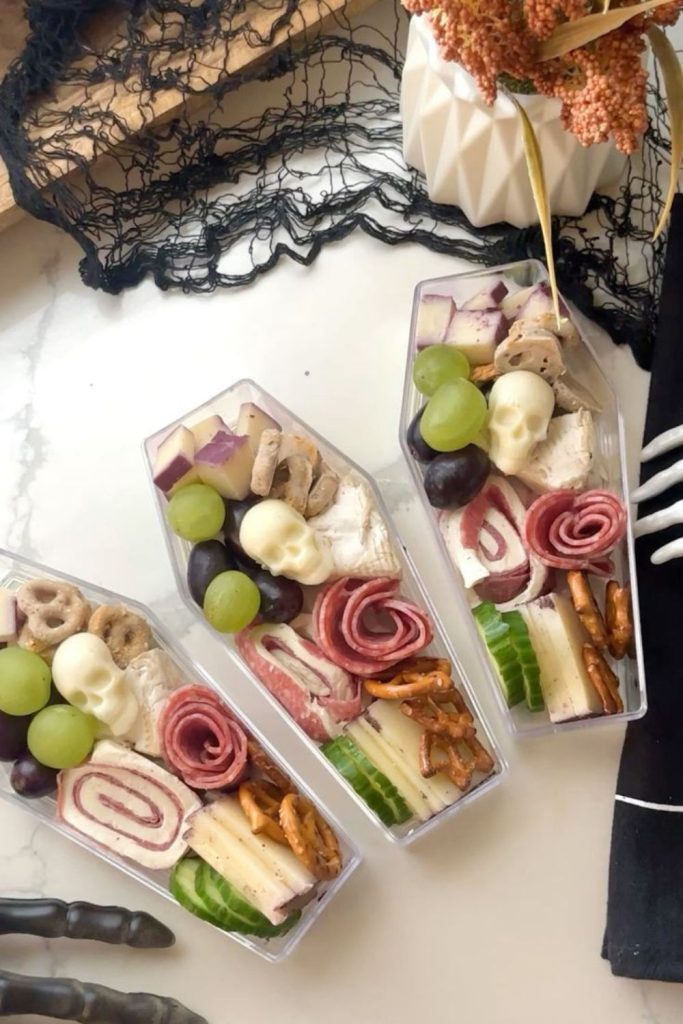 Coffin snack boxes with eerie treats.