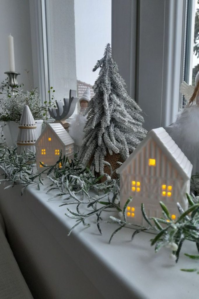 Cotton snow village window decor.