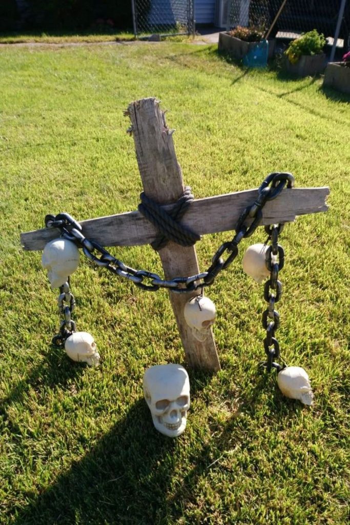 Creepy graveyard display with wooden crosses