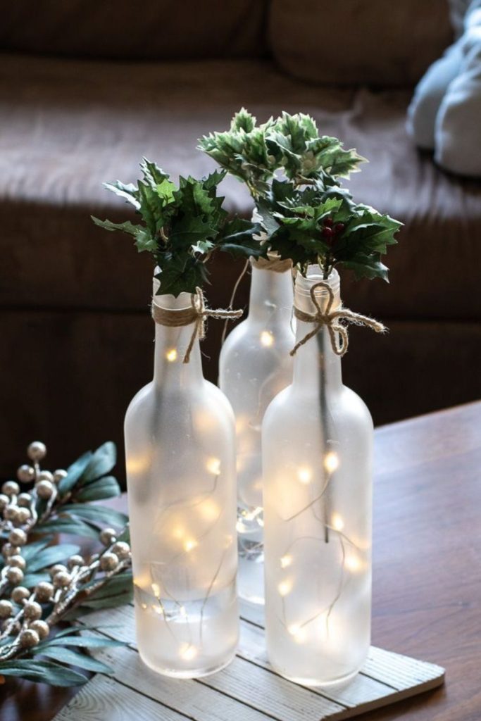 Frosted wine bottle light decor.
