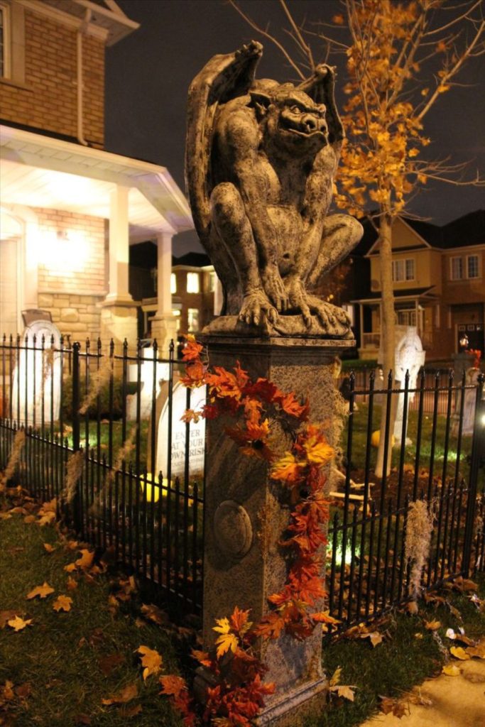 Gargoyle statues guarding spooky entrance