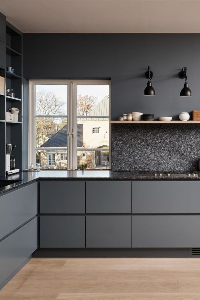 Minimal graphite kitchen with steel touches.