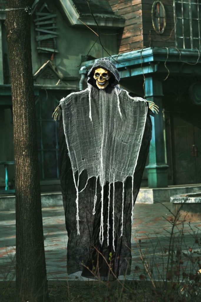 Grim Reaper figure guarding haunted yard