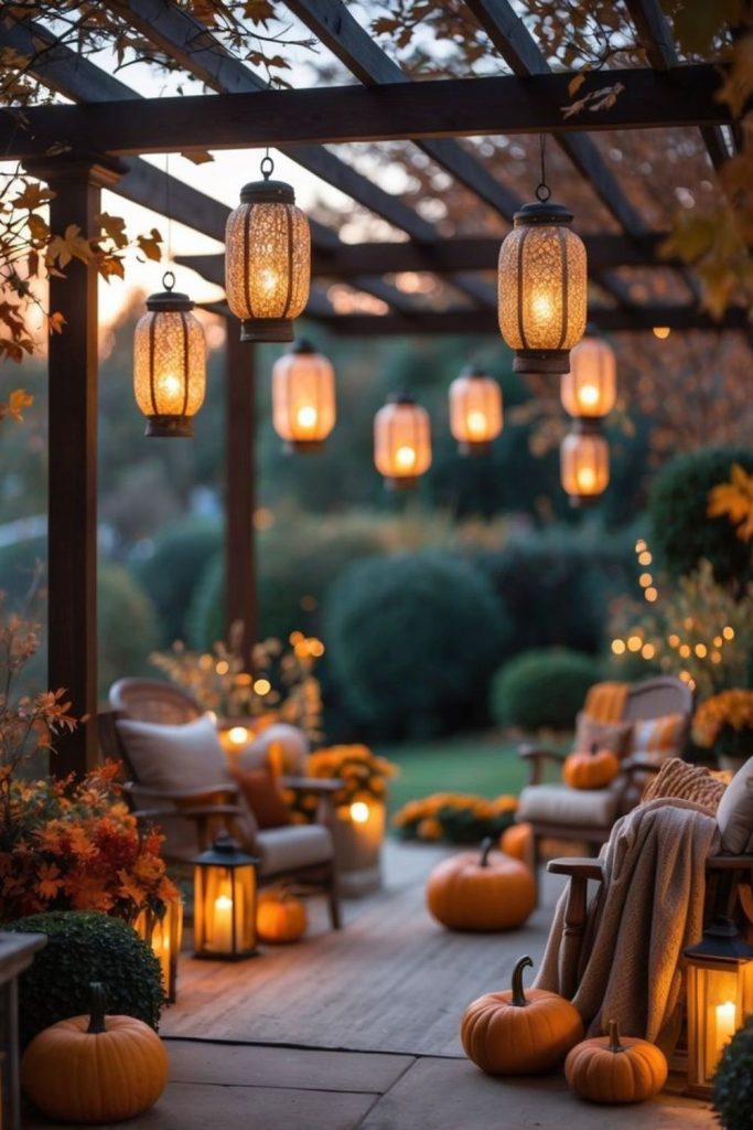 Lantern-lit harvest porch with pumpkins.