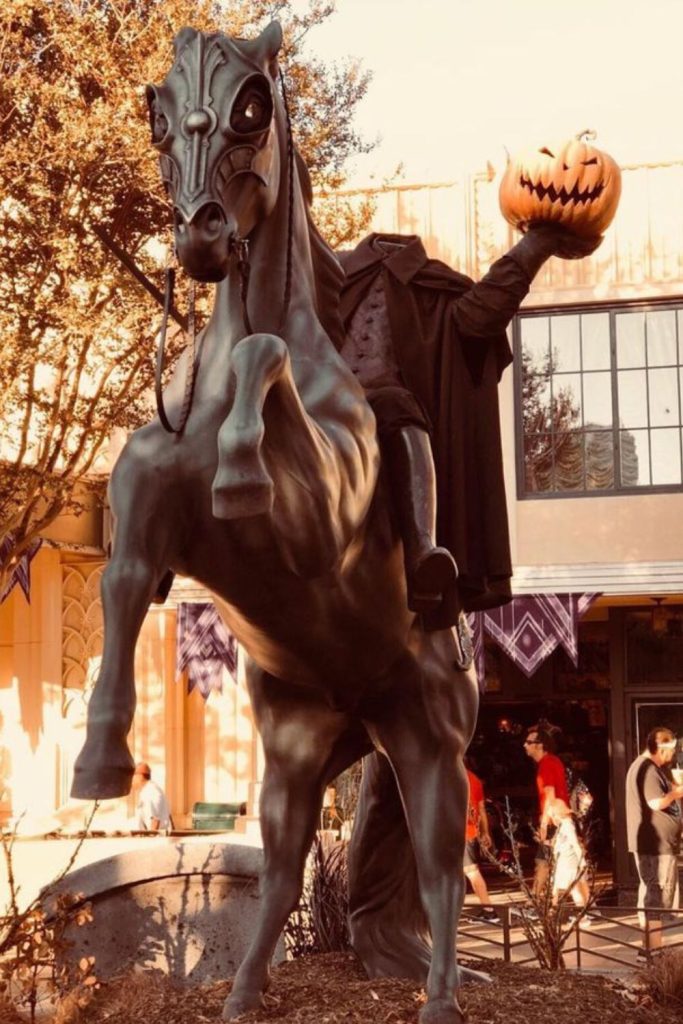 Headless horseman display with glowing pumpkin