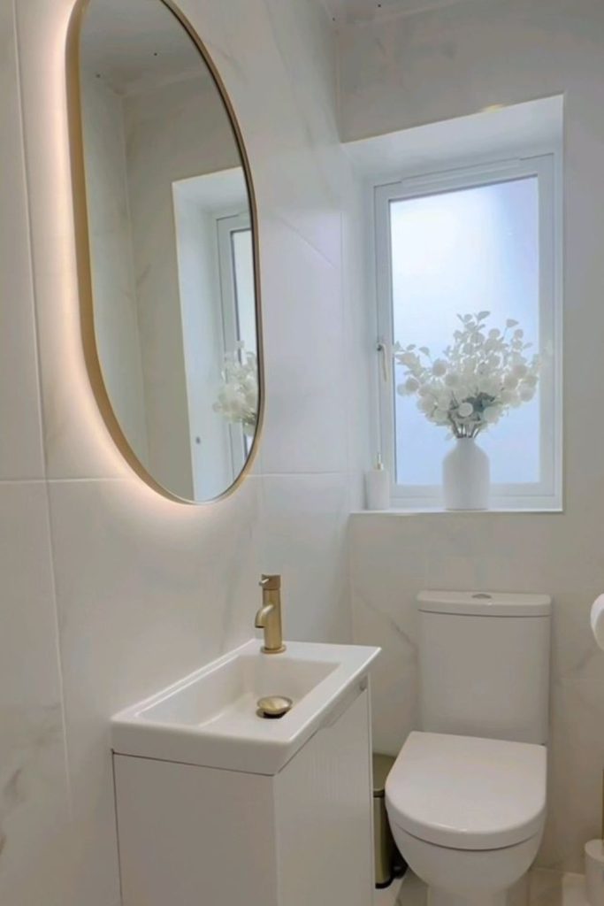 Minimal white moonlit modern bathroom space.