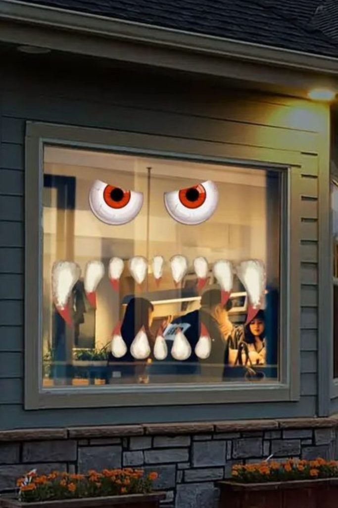 Monster mouth teeth framing window edges.